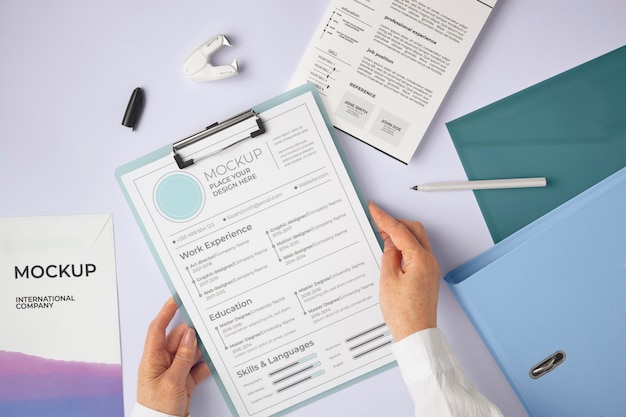 PSD person holding document mock-up with clipboard