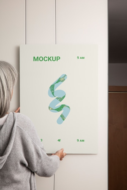 Person holding poster mockup