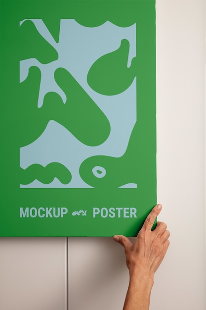 Person holding poster mockup