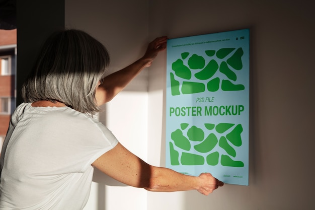 Person holding poster mockup