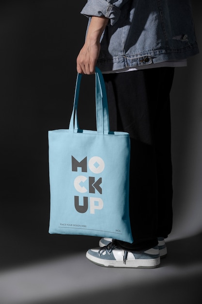 Person holding totebag mockup