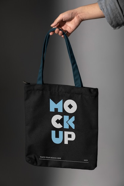 Person holding totebag mockup