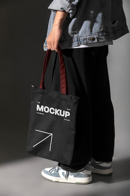 Person holding totebag mockup