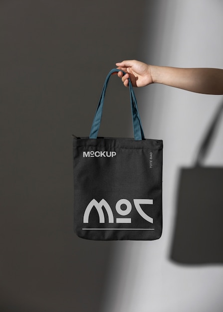 Person holding totebag mockup