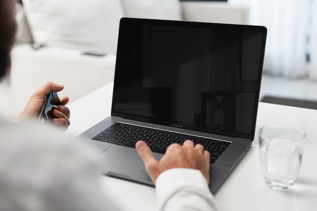 PSD a person is using a laptop with a black screen that says quot the word quot on it