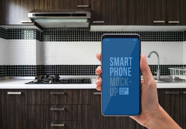 PSD person using application on smartphone for kitchen controlled