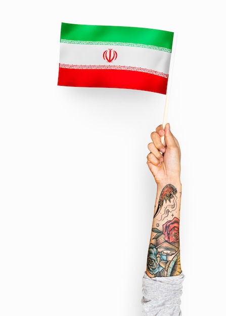 Person waving the flag of Islamic Republic of Iran