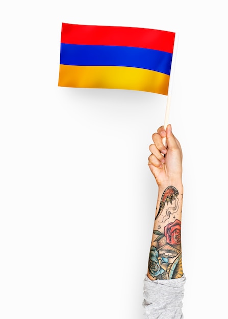 Person waving the flag of Republic of Armenia