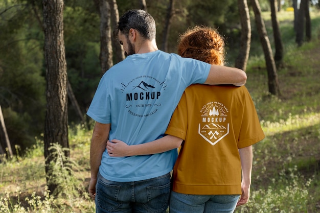 Person wearing mock-up t-shirt outdoors in nature