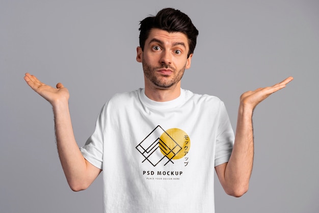 Person with excited expression wearing tshirt mockup