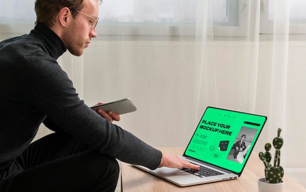 Person working on laptop device from home