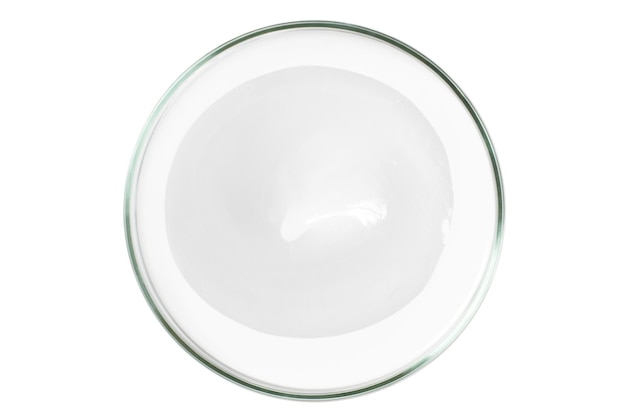 Petri dish isolated on empty background A smear of cosmetic cream in a Petri dish