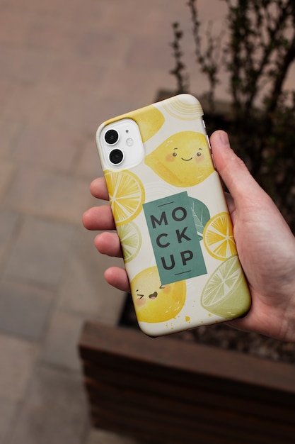 Phone case mockup held in hand