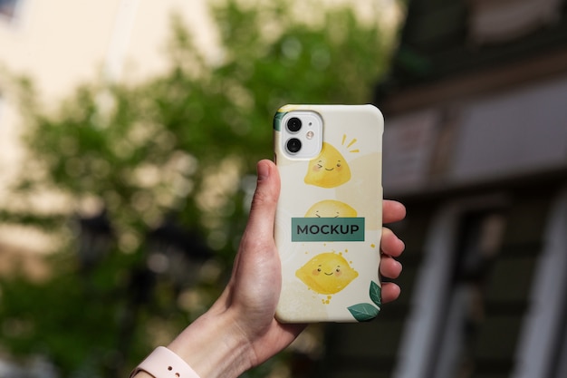 Phone case mockup held in hand