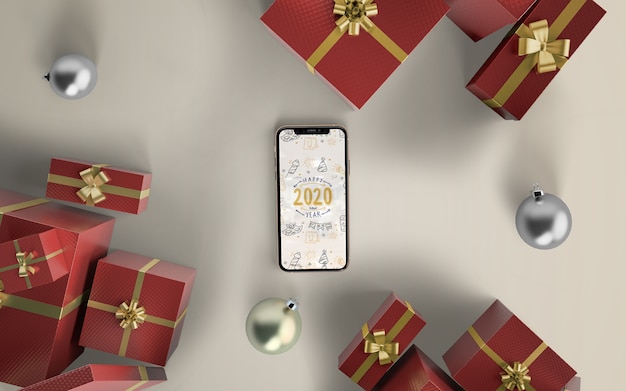 Phone mock-up with christmas gifts