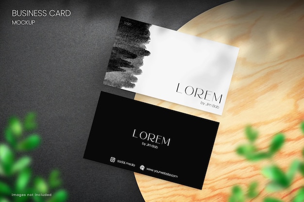 PSD photorealistic business card mockup of two modern cards on a wooden surface