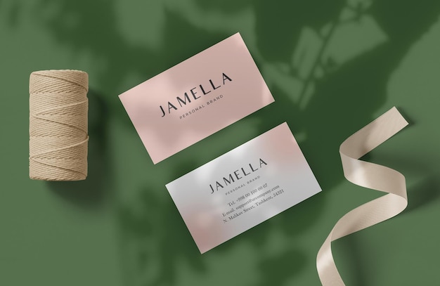 A pink and gold business card with a pink card that says'jammila'on it.