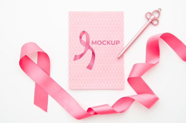 Pink ribbon and key cancer awareness mock-up