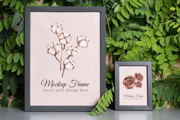 Plant wall and grey frames arrangement