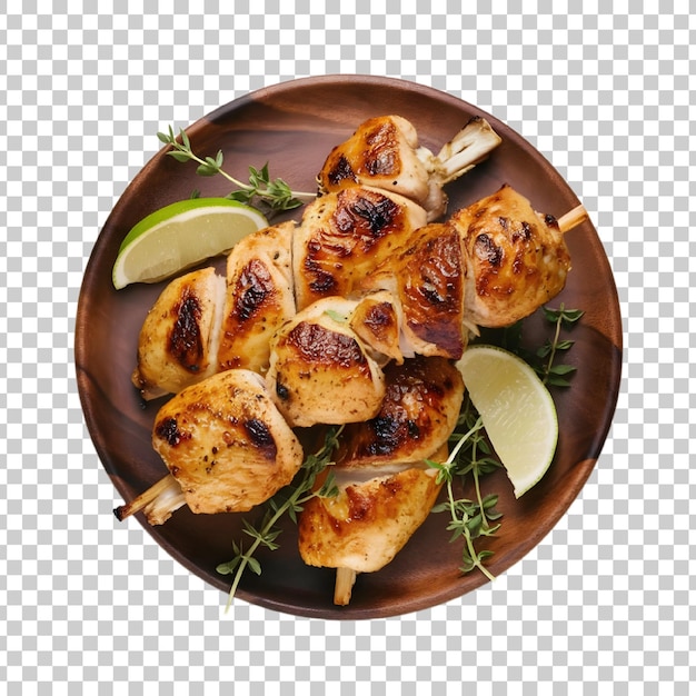 a plate of food with chicken and lime slices