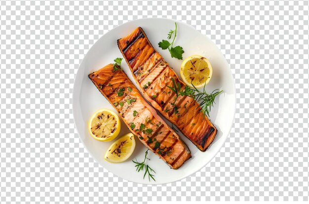 A plate of food with a fish and vegetables grilled salmon with lemon isolated transparent background