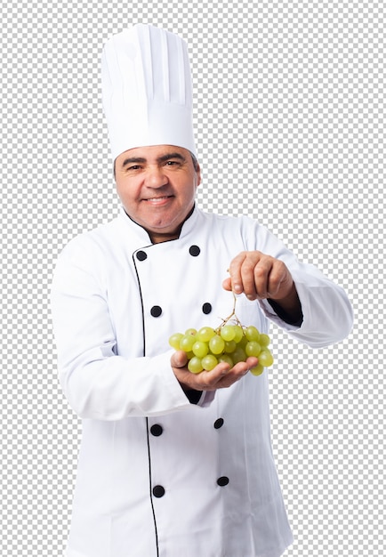 Portrait of a cook man holding a grapes bunch