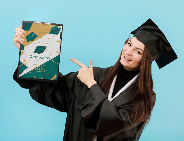 Portrait of student holding diploma