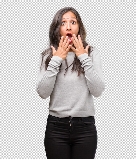 Portrait of young indian woman surprised and shocked, looking with wide eyes, excited by an offer or by a new job, win concept