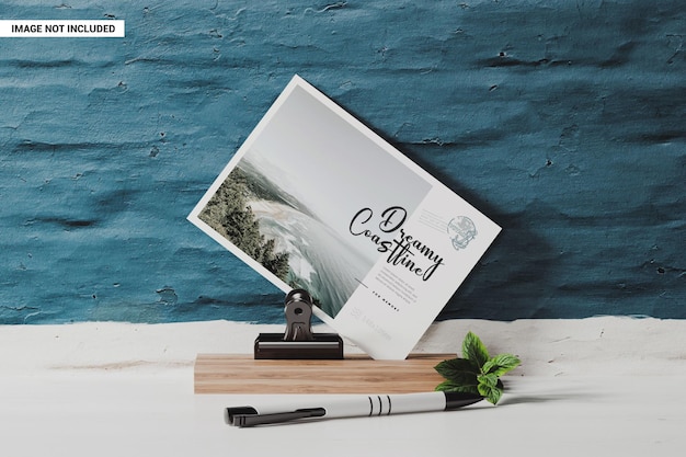 Postal card on a wooden stand with clip mockup