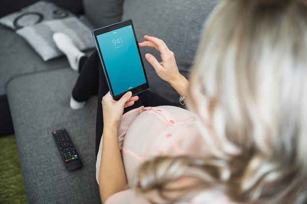 Pregnant woman using tablet