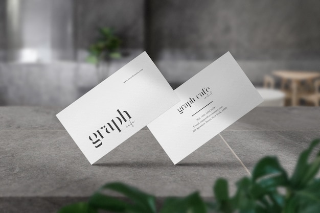 Premium clean minimal business card mockup on stone in grey cafe and light shadow.