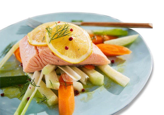 presentation of ceramic platter with fish meat and salad