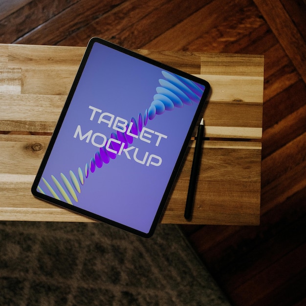 PSD Tablet Pro on wooden table mockup by 9ttwenty