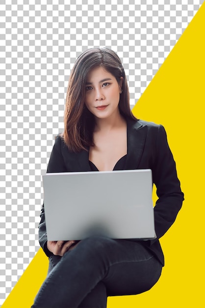 Psd woman in a black suit is sitting with a laptop on a yellow Transparent background