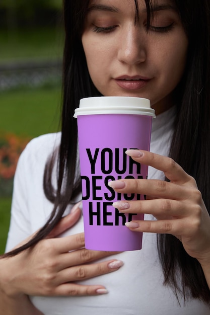 Purple coffee cup in hand mockup custom design changeable color closeup