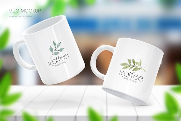 Realistic 11oz coffee cup mockup of two mugs to showcase your own designs