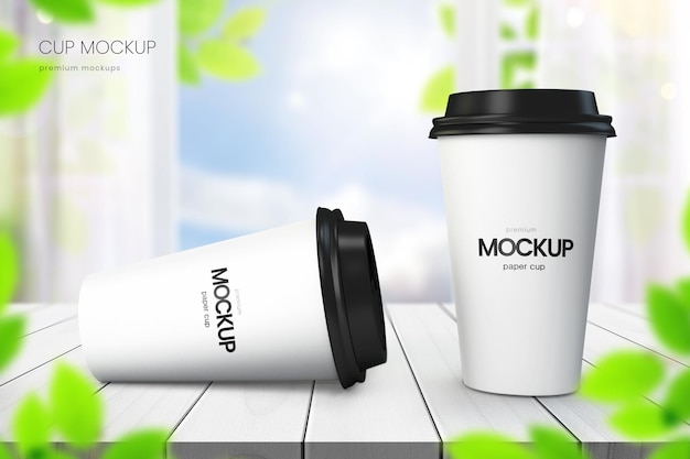 Realistic paper coffee cup mockup of two cups on white wooden tabletop with blue sky in background