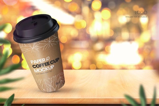 Realistic paper coffee cup mockup on wooden tabletop with bokeh lights in background