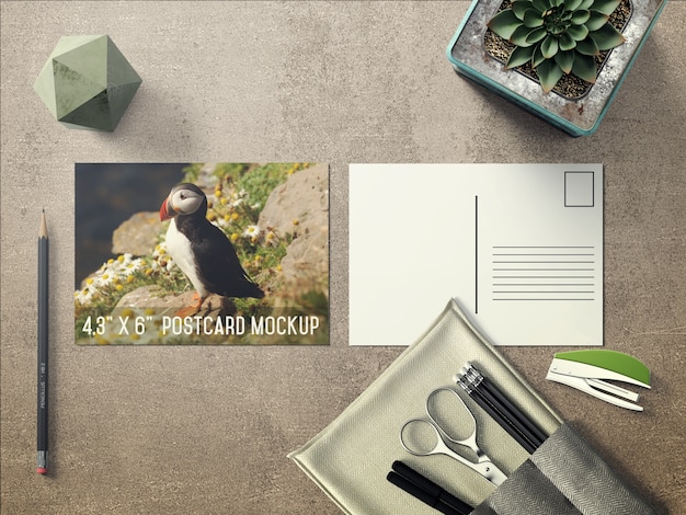 Realistic postcard on desktop mock up