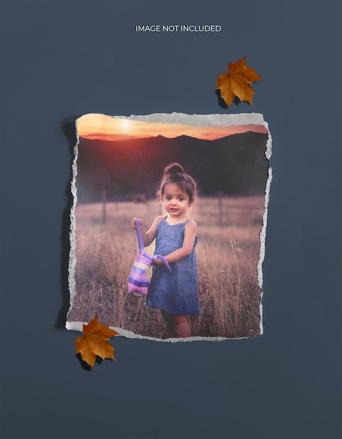 Realistic  torn paper effect photo frame mockup with old leaf