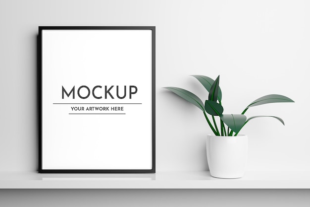 Realistic Vertical Blank Photo Frame Mockup On Desk With Vase Premium Psd