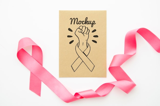 Ribbon and fist cancer awareness mock-up