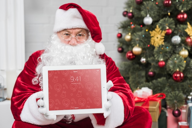 Santa presenting tablet mockup