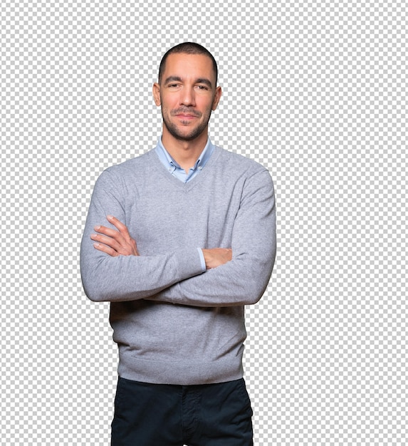 Satisfied young man with crossed arms gesture