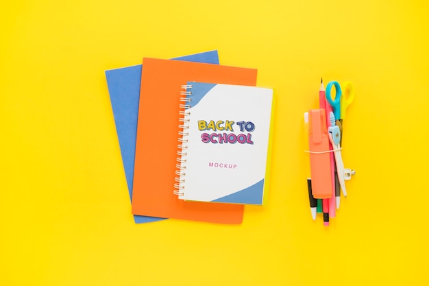 School notebooks on yellow background