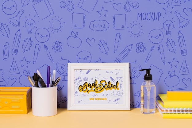 School supplies and hand sanitizer with mock-up