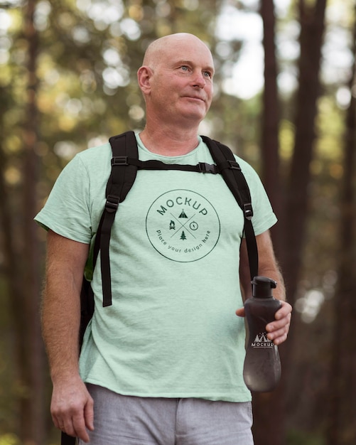 Senior man at camping with a mock-up t-shirt