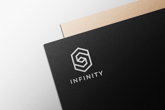 Silver logo mockup on black paper