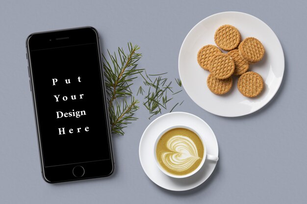 PSD smartphone mock-up with coffee