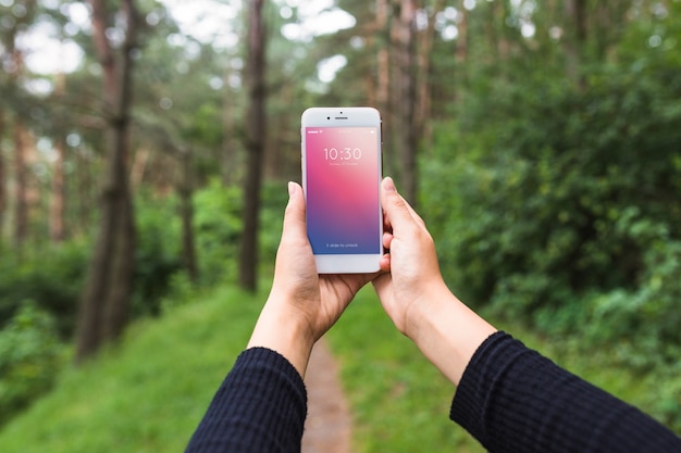 Smartphone screen mockup in forest